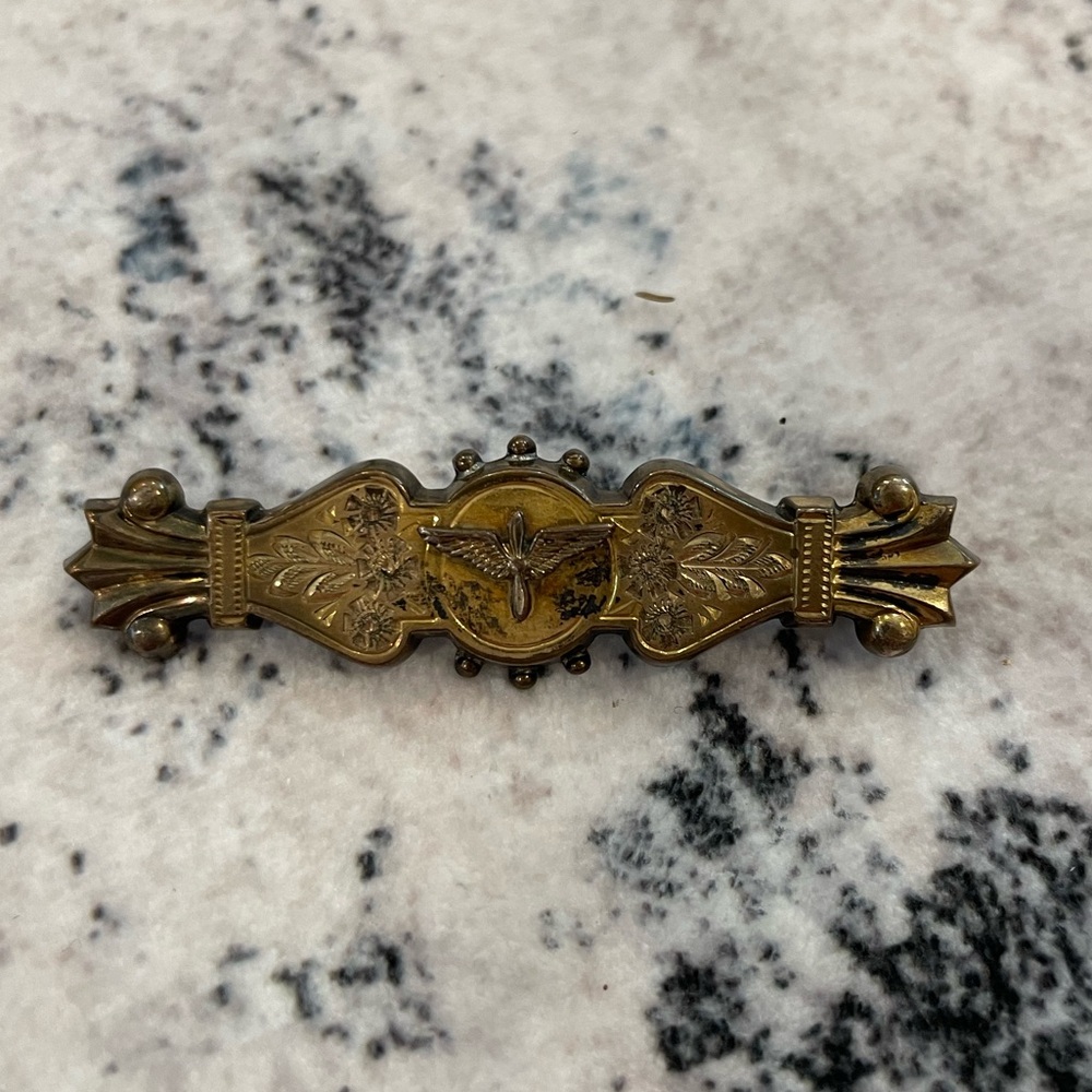 FMCO brooch